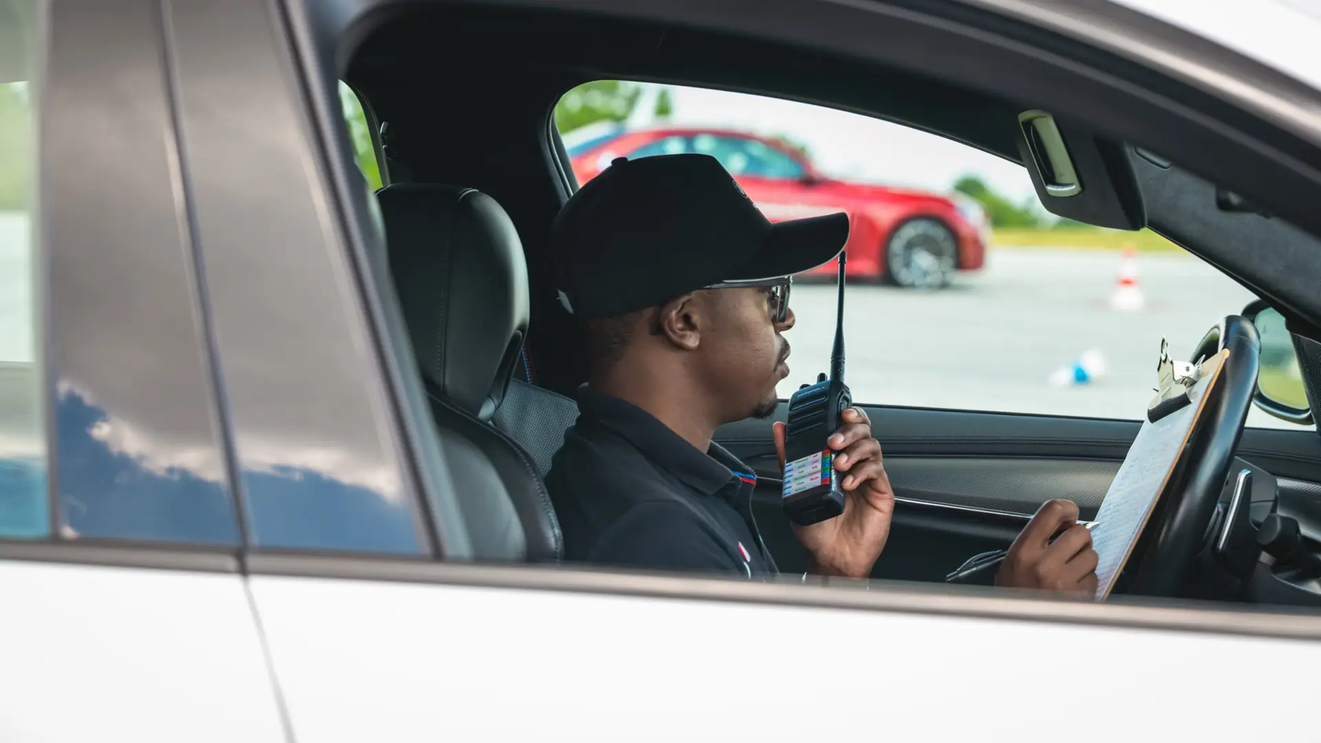 BMW Driving Instructor on walkie-talkie