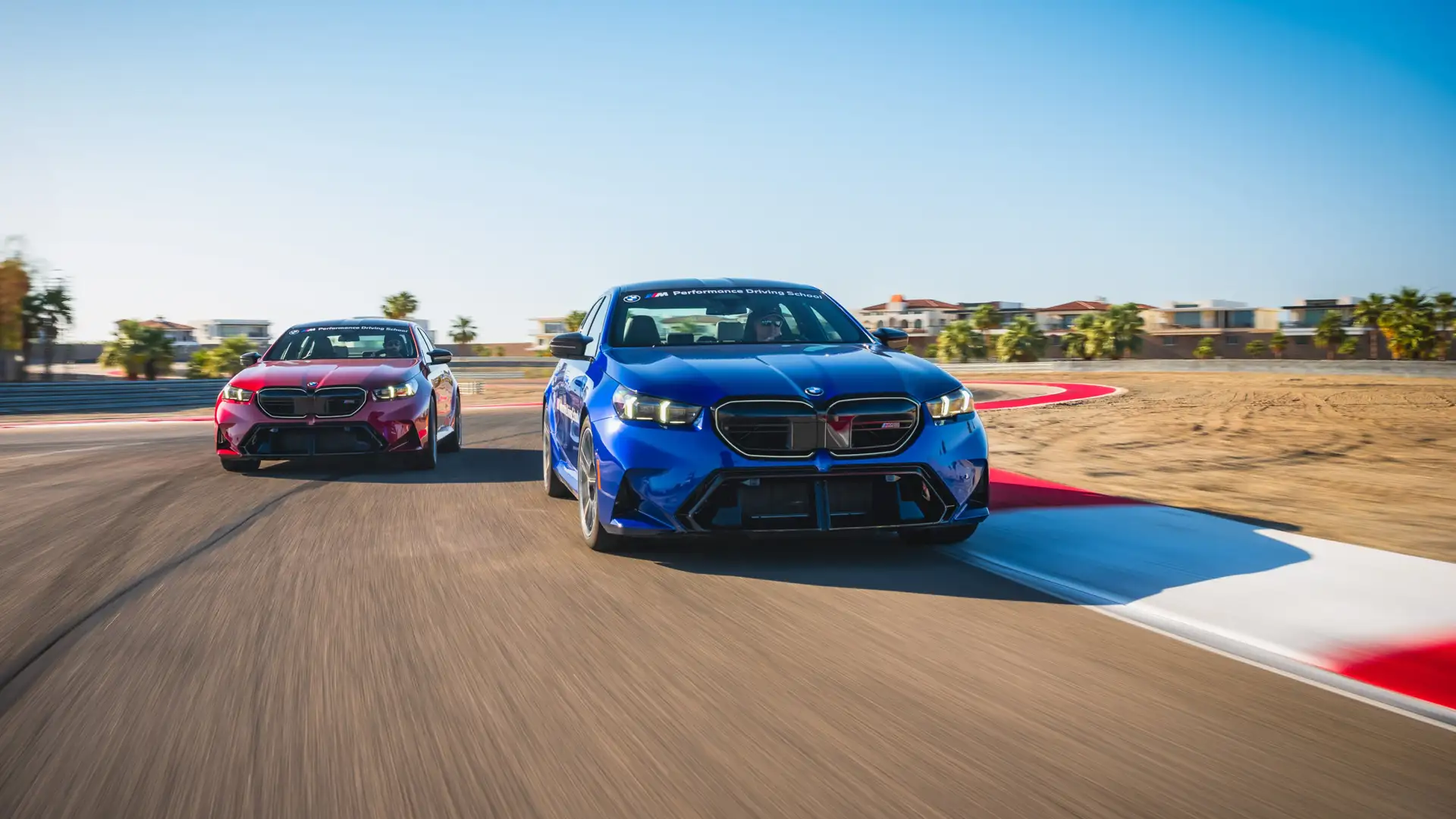 BMW M5 pair on track