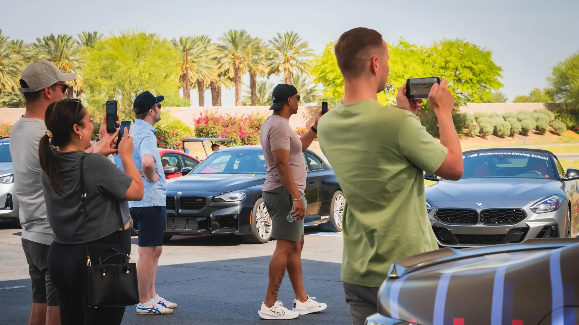 Group of BMW Performance Center participants filming