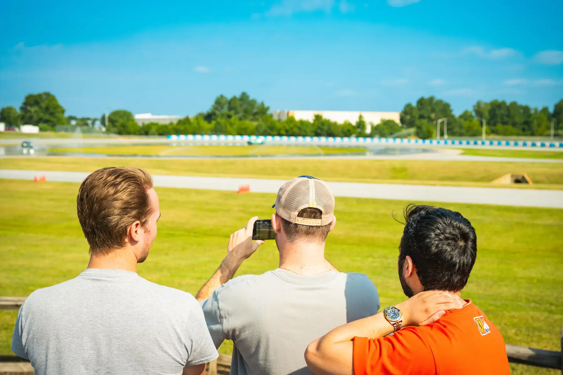 Group of BMW Performance Center participants filming