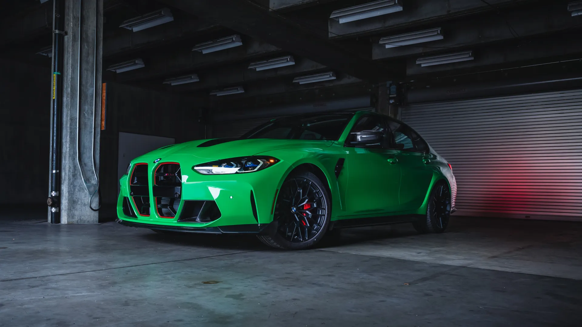 Signal Green BMW M3 parked in a garage